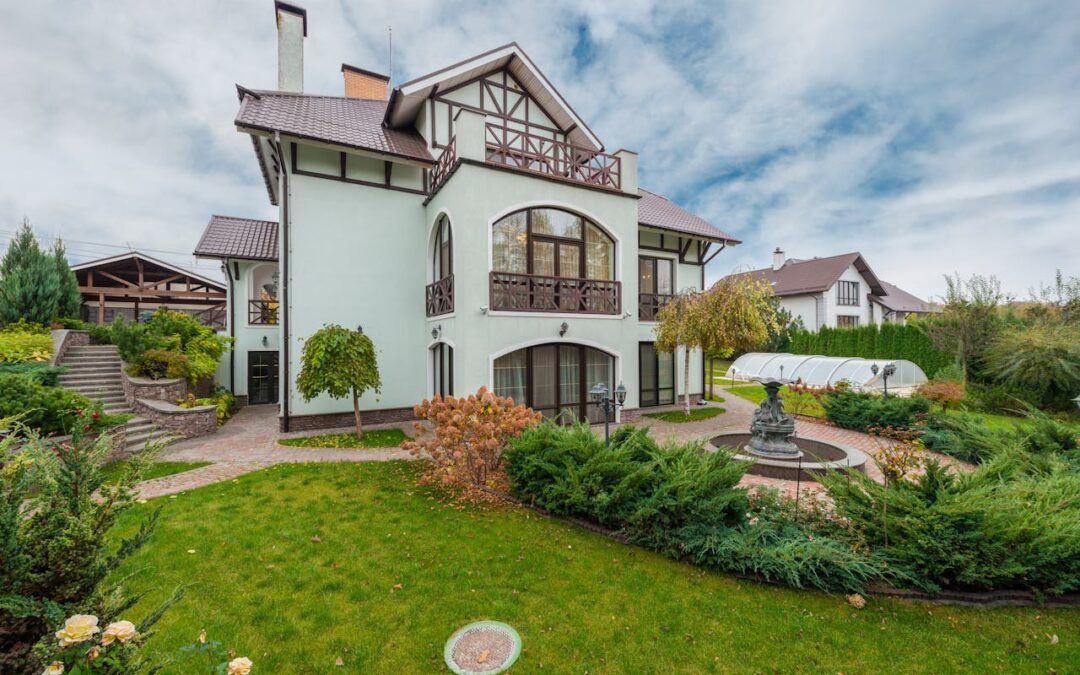 house with a fountain in front